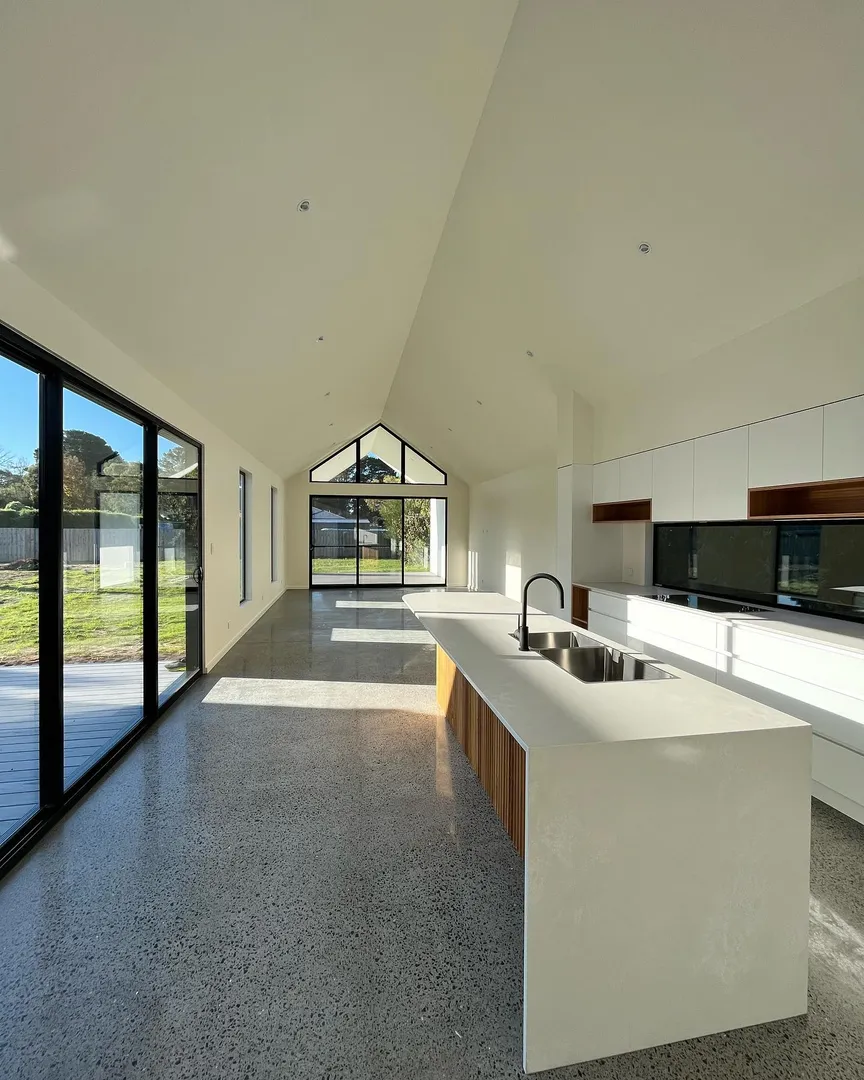 Modern kitchen with large windows and island counter